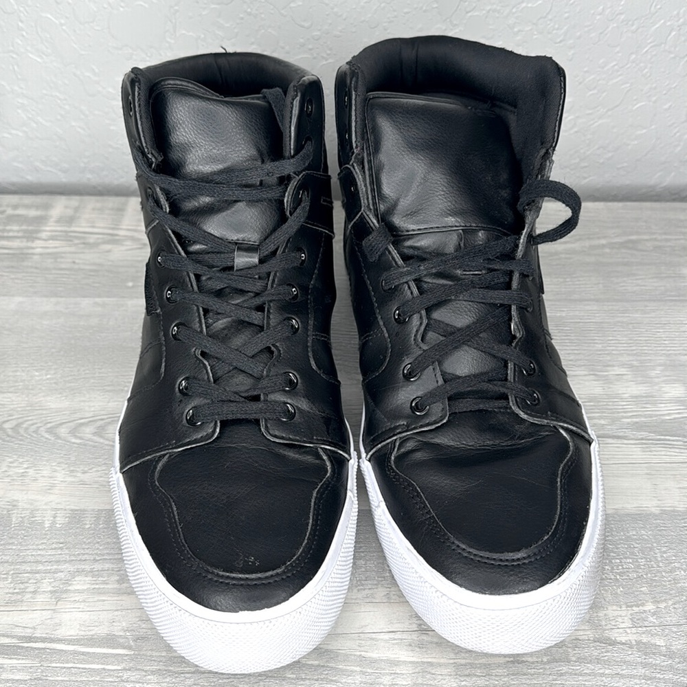 Stylish and versatile black high-top sneakers perfect for any casual outing.